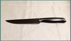 A stainless steel long chefs knife